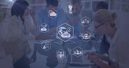 Image of network of digital icons over diverse business people