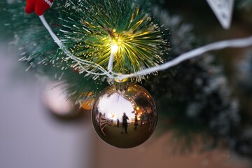 closeup of decorative balls hanging on christmas tree