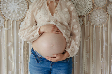 woman holding baby belly