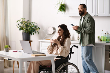 pretty disabled woman in wheelchair working remotely near her husband looking at phone on backdrop