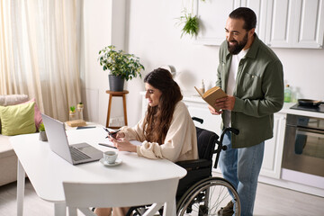 positive disabled woman in wheelchair working remotely at home next to her reading husband