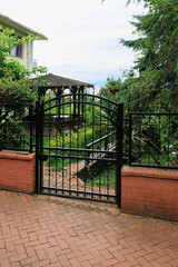 Gates and wickets, iron bars and forged patterns on the doors. City views on the streets, public place in Turkey, on a summer sunny day