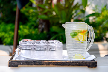 Fresh citrus lemonade with ice lime and lemon jar in the at pool bar