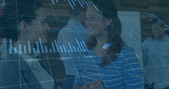 Image of statistical data processing over two diverse businesswomen discussing at office