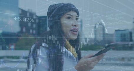 Image of financial data processing over businesswoman using smartphone