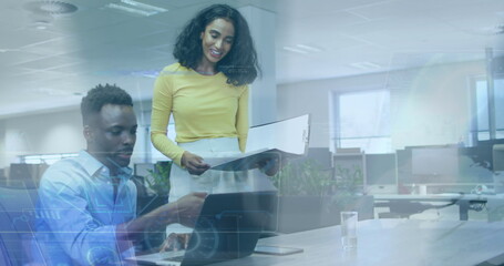 Image of data processing over diverse man and woman discussing over laptop at office