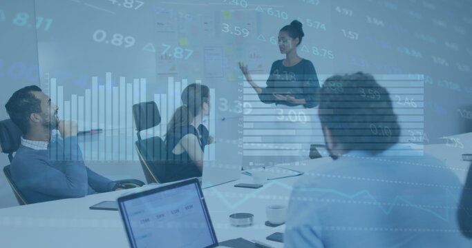 Image of stock market data processing over african american woman giving presentation at office - Powered by Adobe