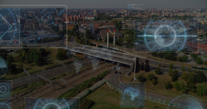 Image of round scanners and data processing against aerial view of cityscape