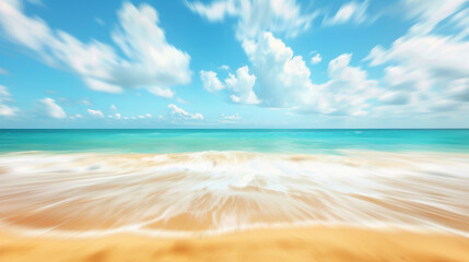 Blurry abstract of lively tropical beach with golden sand, turquoise ocean, and blue sky.