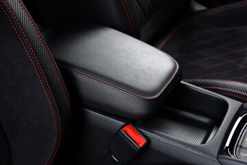 Armrest in the car for driver. Car armrest. Armrest between front seats inside the car. Luxury car...