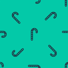 Blue line Christmas candy cane with stripes icon isolated seamless pattern on green background. Merry Christmas and Happy New Year. Vector