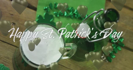  Image of st patrick's day text and green hearts and glass of beer on wooden background © vectorfusionart
