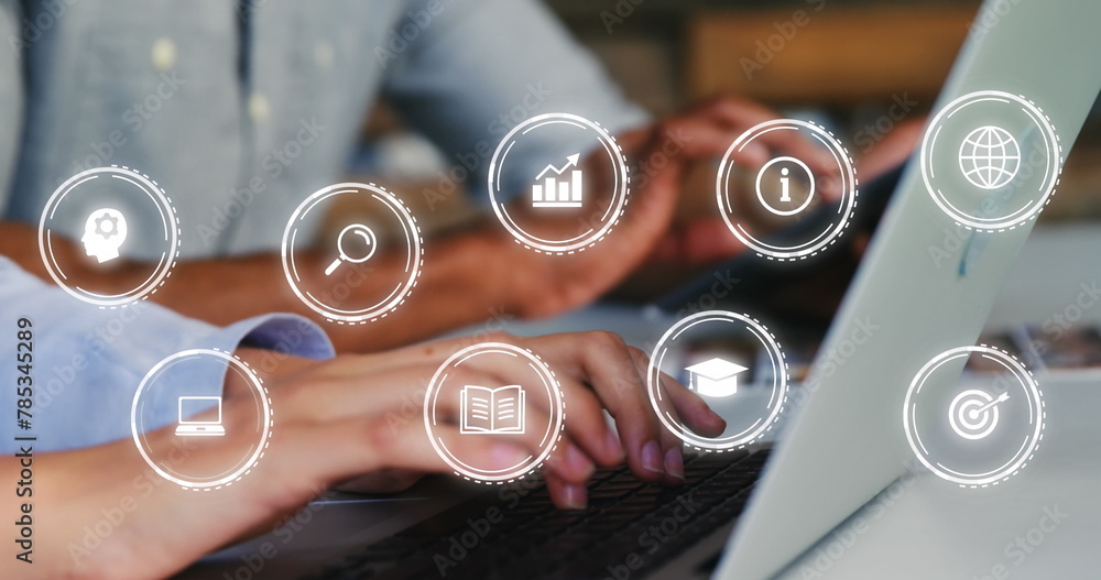 Poster image of multiple icon in circles over diverse coworkers using laptop and cellphone in office