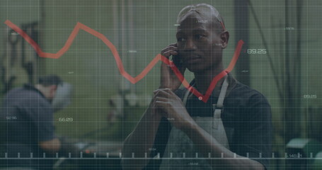 Image of red lines and financial data processing over african american man on smartphone
