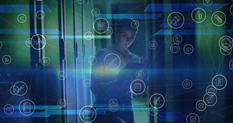 Image of floating media icons over caucasian female technician working in server room