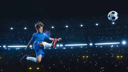 Aesthetic Shot Of Athletic Child Soccer Football Player Jumping And Kicking Ball Mid Air On Black...