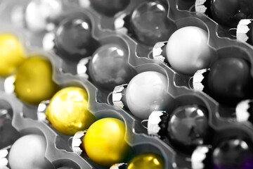 Bright Christmas balls in container