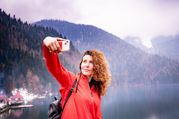 woman with smartphone taking selfie - 785357469