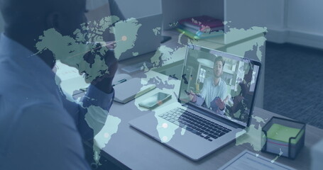 Image of world map over african american businessman having image call