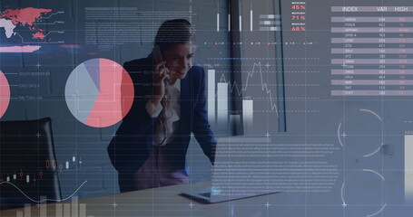 Image of statistics and data processing over man using computer