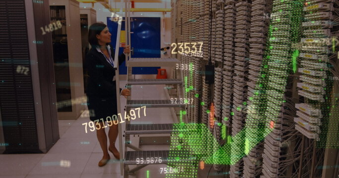Financial data processing against caucasian female engineer working in server room