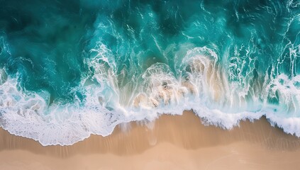 Beautiful aerial view of a white sandy beach and turquoise ocean waves during summer time