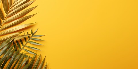 Palm leaf on a gold background with copy space for text or design. A flat lay, top view. A summer vacation concept