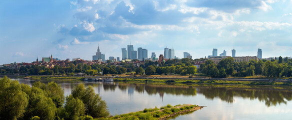 Cityscape, panorama, banner - view of the district of Srodmiescie in the center Warsaw, view from the Vistula River, Poland