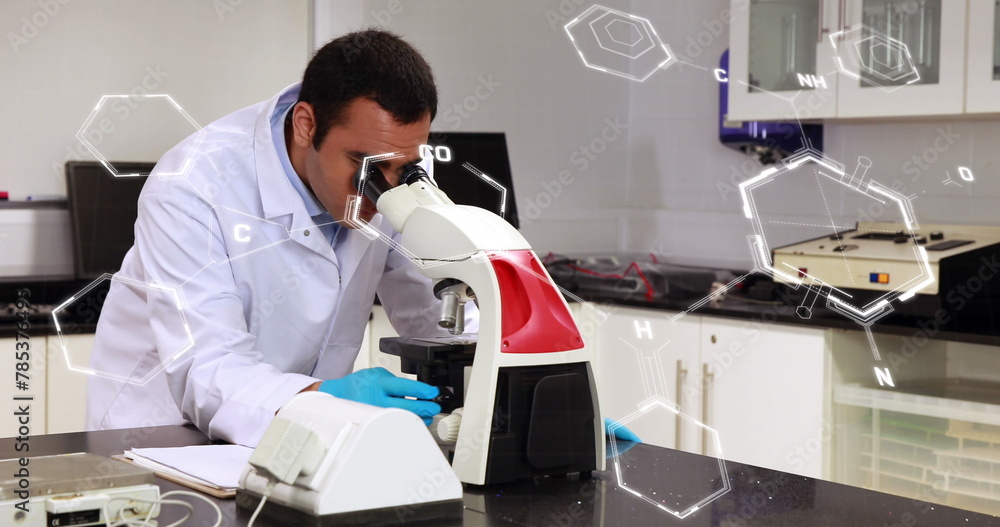 Poster image of scientific data processing over male scientist using microscope in laboratory