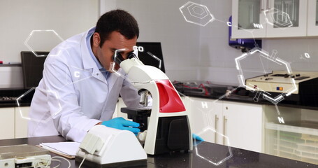 Image of scientific data processing over male scientist using microscope in laboratory
