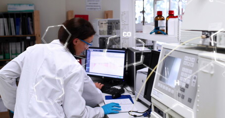 Image of chemical formulas over caucasian female lab worker using computer