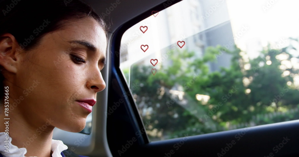 Canvas Prints Multiple red heart icons floating against close up of caucasian woman smiling in the car