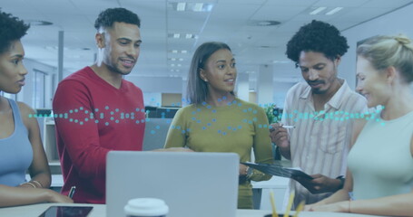 Image of graphs over diverse coworkers in office