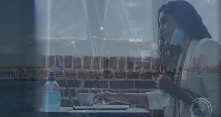 Image of connections over caucasian woman in face mask in office