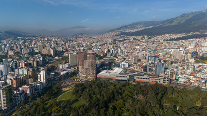 Fototapeta na wymiar Aerial drone view of Quito capital city of Ecuador South America Parque La Carolina Sunrise early morning traffic