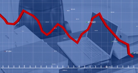 Image of statistical data processing against close up of a desk at office