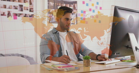 Image of world map and data processing over biracial businessman using computer