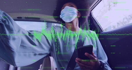 Image of financial data processing and woman in face mask in car