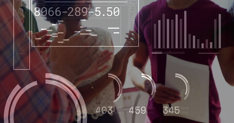 Image of financial data processing over diverse business people working at office