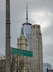 police plaza street sign with downtown manhattan new york city skyline view in the background...