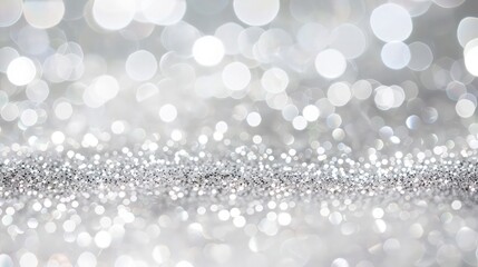  Bathed in a soft silver glow, an abstract bokeh background captivates the eye with its enchanting beauty. 