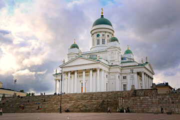 Helsinki Cathedral on a summer evening with dramatic cloudy sky. The church was originally built...