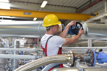 Mechanics repair a machine in a modern industrial plant - professionell occupation job