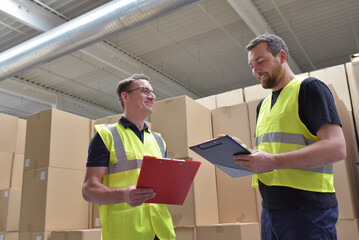 Worker in a warehouse in the logistics sector - transport and processing of orders in trade - 785409416