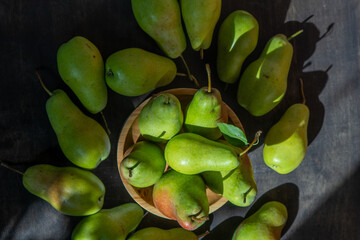 Parisian pear variety. Fruits on the table. Autumn harvest. Pears top view background. Green yellow red color pear. Vitamin vegan food.