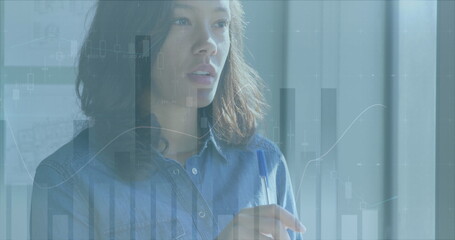 Image of data processing over caucasian businesswoman in office