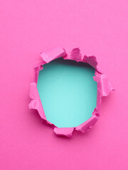 Ripped pink paper with hole in the center - 785411084