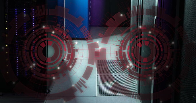 Image of two round scanners spinning against computer server room