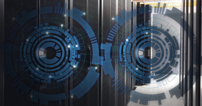 Image of two round scanners spinning against computer server room