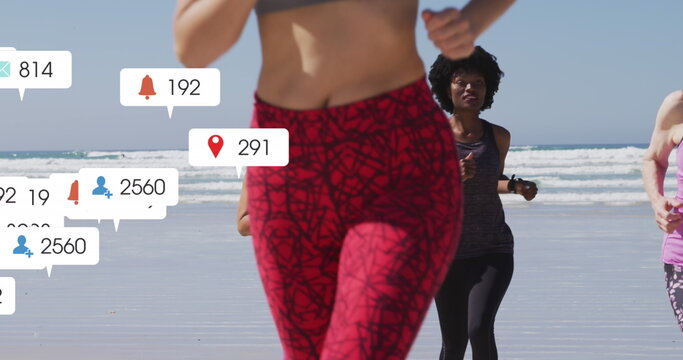 Image of social media data processing over diverse women exercising on beach